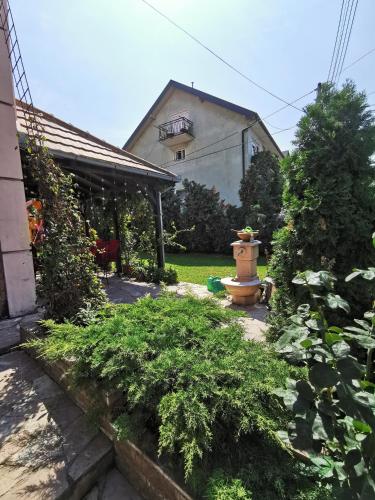a fire hydrant in the yard of a house at Apartments "Villa Miona" in Belgrade