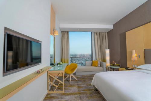 Postel nebo postele na pokoji v ubytování Dana Rayhaan by Rotana