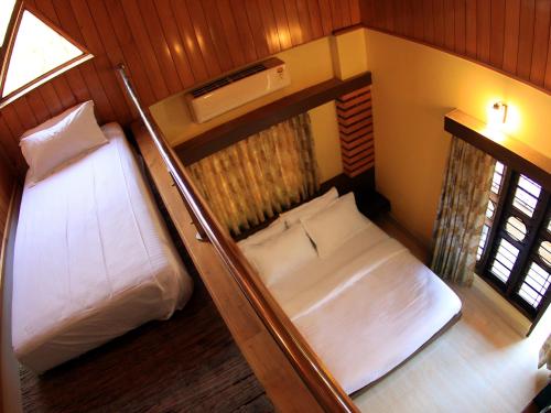 Ein Bett oder Betten in einem Zimmer der Unterkunft The Reserve Gorumara