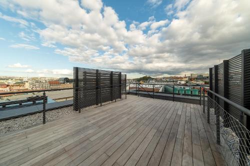 a wooden deck with a view of the water at Luxury apartment in the centre in Prague