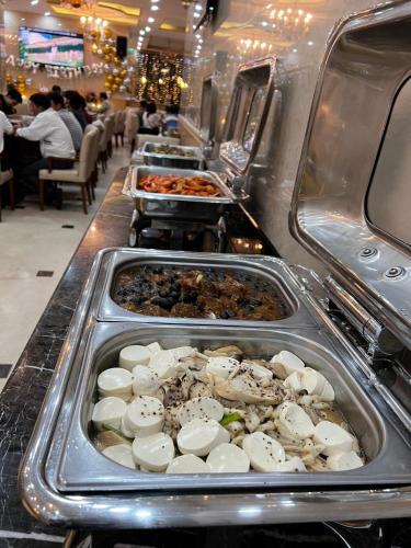 a buffet line with many different types of food at Roy Dala Hotel in Da Lat