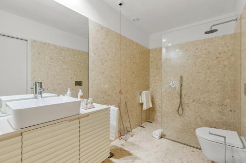 a bathroom with a toilet and a sink and a shower at 108MM House in Porto
