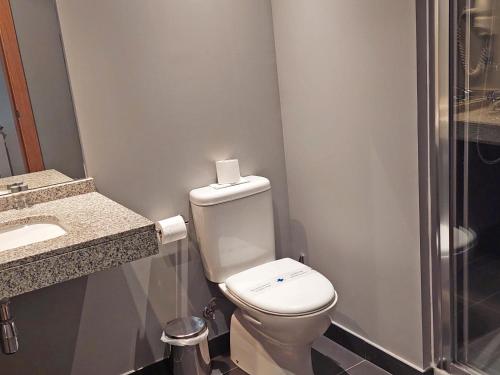 a bathroom with a toilet and a sink and a shower at The Lodge at Ribasol in Arinsal