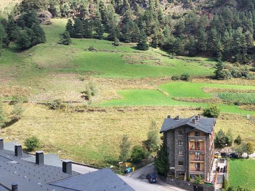 an aerial view of a house and a field at The Lodge at Ribasol in Arinsal