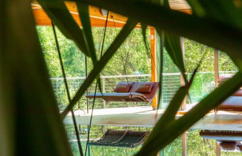 a view of a porch with a swing and chairs at Hotel-Restaurant Liebnitzmühle in Raabs an der Thaya