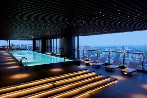 a swimming pool on the top of a building at Park Hyatt Jakarta in Jakarta