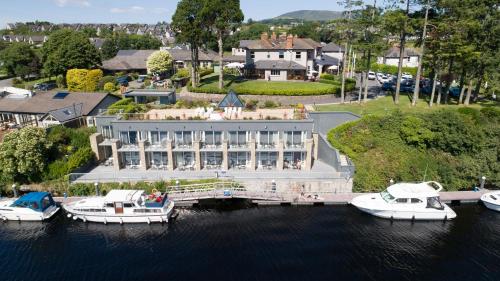 an aerial view of a hotel with boats in the water at The Lakeside Hotel & Leisure Centre in Killaloe