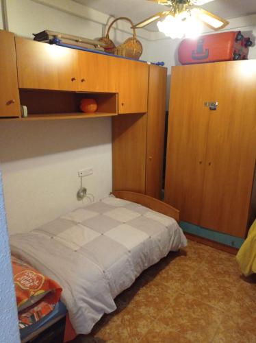Ένα ή περισσότερα κρεβάτια σε δωμάτιο στο Apartamento Merlin
