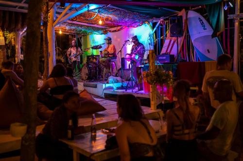 a group of people watching a band on a stage at Indie Beach Bungalows in Ko Chang