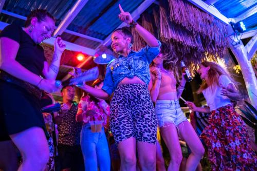 a group of women dancing at a party at Indie Beach Bungalows in Ko Chang