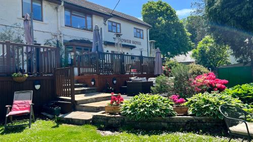 a house with a garden with flowers in the yard at The Gower Hotel in Swansea