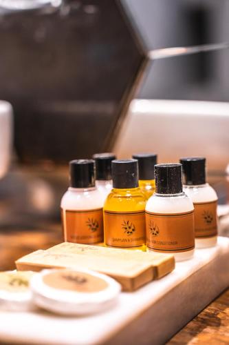 four bottles of essential oils sitting on a counter at West Pera Hotel in Istanbul
