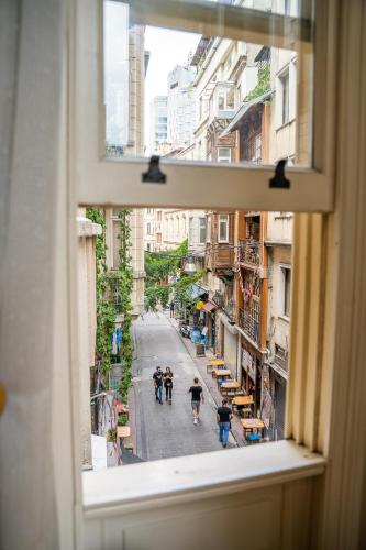 a view of a city street from a window at West Pera Hotel in Istanbul