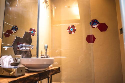 a bathroom with a sink and a shower at West Pera Hotel in Istanbul