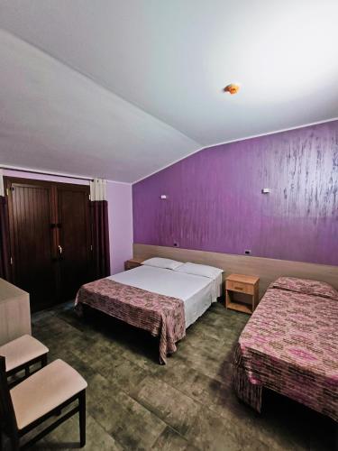 Postel nebo postele na pokoji v ubytování Agriturismo - B&B "La Funicolare"