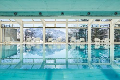 a swimming pool with a view of the water at Hotel Mondolé in Prato Nevoso