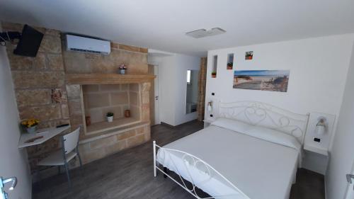 A bed or beds in a room at La Corte dei Marchesi