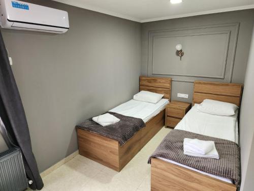 Una cama o camas en una habitación de Hotel Rose
