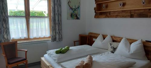 a bedroom with two beds with stuffed animals on them at Apartment Tamara's in Heiligen Gestade