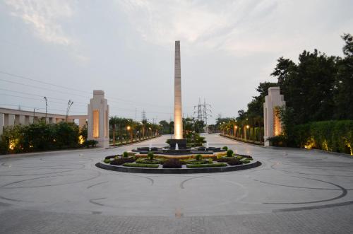 a large courtyard with a fountain in the middle at The Umrao in New Delhi