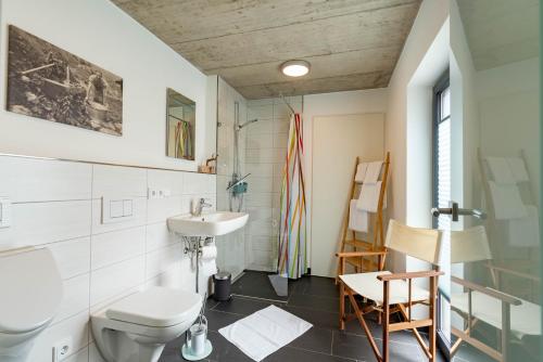 a bathroom with a toilet and a sink at Fewo am Aubach-Josefine in Blaichach