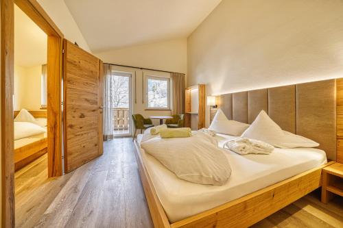 Postel nebo postele na pokoji v ubytování Family Hotel Gutenberg