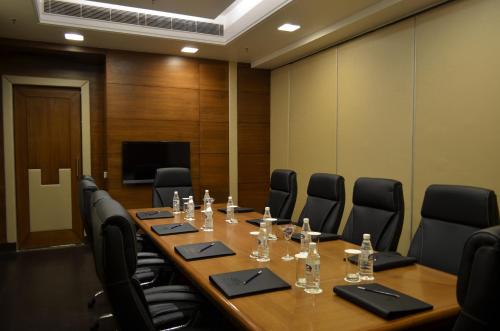 a conference room with a long table and chairs at The Umrao in New Delhi