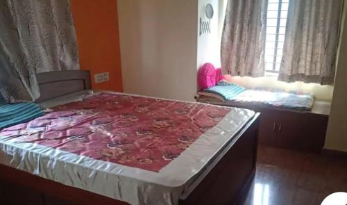 a large bed in a room with at Shree Homestay in Manipala