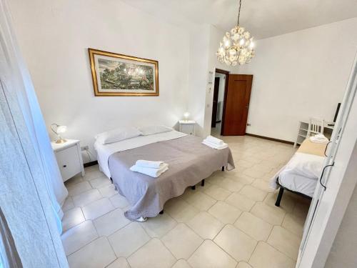 A bed or beds in a room at Romano B&B