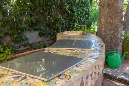 a stone table with a tray on top of it at Dimora Migliori in Viagrande