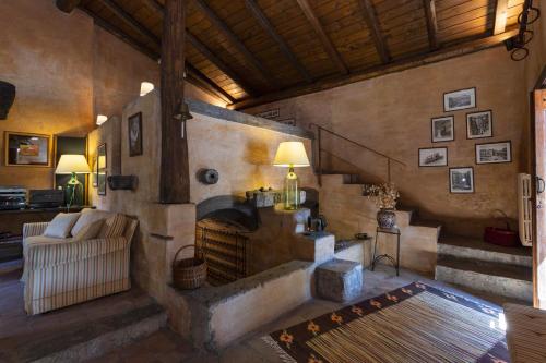 a living room with a fireplace and a couch at Dimora Migliori in Viagrande
