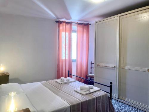 Ένα ή περισσότερα κρεβάτια σε δωμάτιο στο Casa Vacanze La Casa di Nonna Libia vicino Saturnia