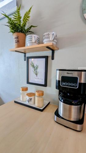 a kitchen counter with a coffee maker and a microwave at Villas at Chalet De Buye in Cabo Rojo