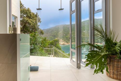a house with a view of the water at Infinity Villa in Knysna