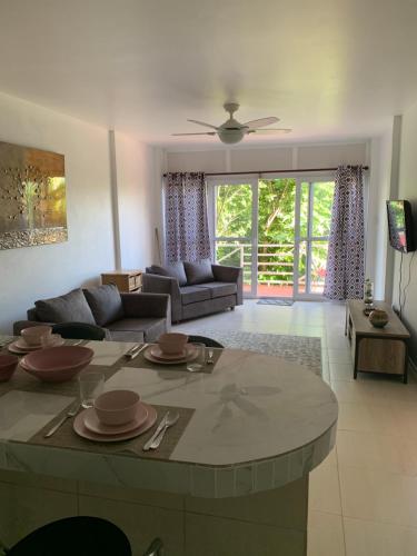 a living room with a table and a couch at Kay Nou Apartments in Gros Islet