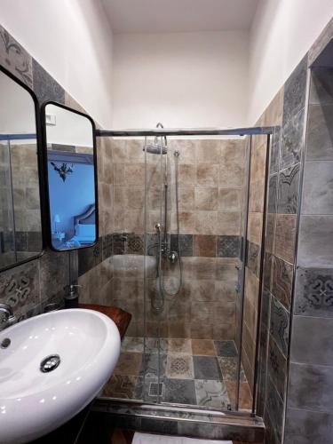 a bathroom with a shower and a sink at Villa Valminuta in Ercolano