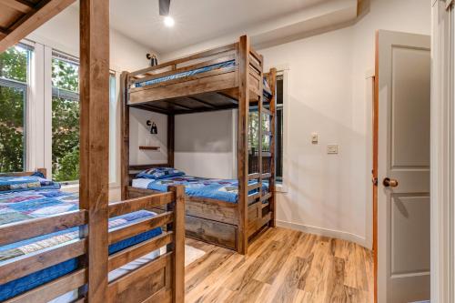 a bedroom with two bunk beds and a doorway at Eagle Springs East 101: Red-wing Suite in Solitude
