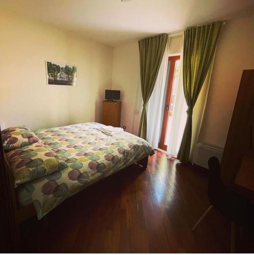 Postel nebo postele na pokoji v ubytování Dino's B&B