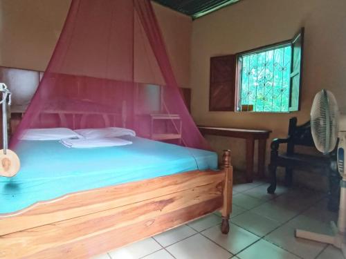 Ένα ή περισσότερα κρεβάτια σε δωμάτιο στο Hostal Así es mi Tierra