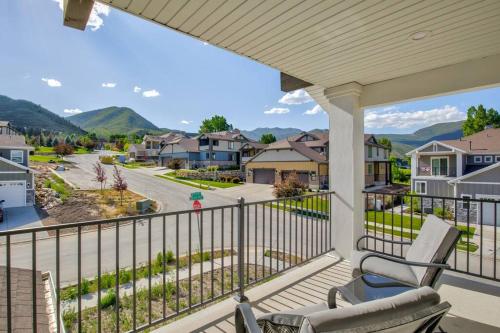 a balcony with a chair and a view of a street at Midway to Heaven! BRAND NEW 5 bed 4.5 bath, HOTTUB in Midway