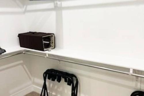 a microwave sitting on a shelf next to a chair at Midway to Heaven! BRAND NEW 5 bed 4.5 bath, HOTTUB in Midway
