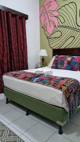 a bed in a room with at AMINA Inn in Flores