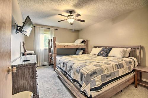 a bedroom with two bunk beds and a ceiling fan at Cozy Condo with Magic Mountain Ski-In Access! in Londonderry