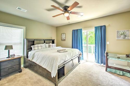 a bedroom with a bed and a ceiling fan at Historic Home Near Bathhouse Row in Hot Springs! in Hot Springs