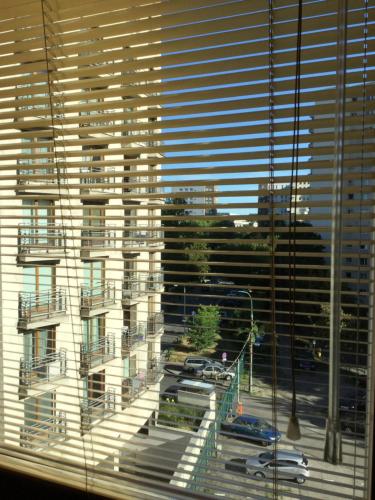 a view of a large building from a window at President Apartments by WarsawResidence Group in Warsaw