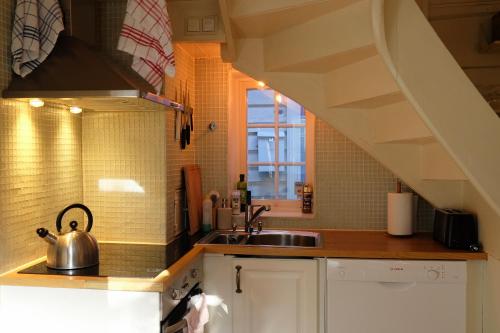 a kitchen with a sink and a sink at Charming Bergen house, rare historic house from 1779, Whole house in Bergen