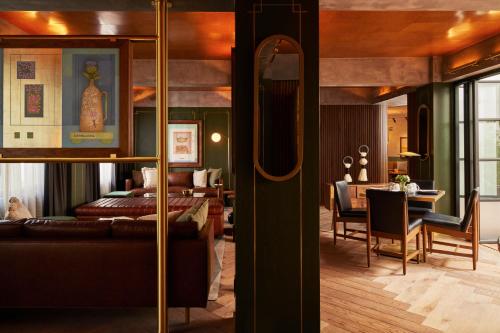 a living room with a couch and a dining room at Campos Polanco in Mexico City