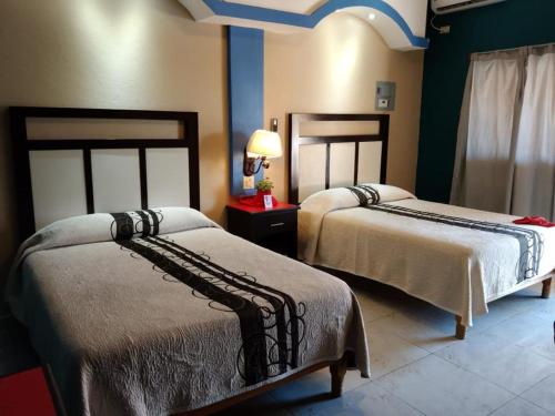 Ένα ή περισσότερα κρεβάτια σε δωμάτιο στο HOTEL PARAÍSO DEL VALLE