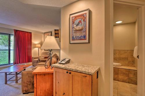 a living room with a couch and a table with a lamp at Beaver Run Resort 4228 in Breckenridge