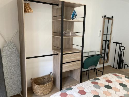 a bedroom with a closet with a mirror and a bed at L'ATELIER - à coté abbatiale - clim reversible - Ideal couples in Moissac